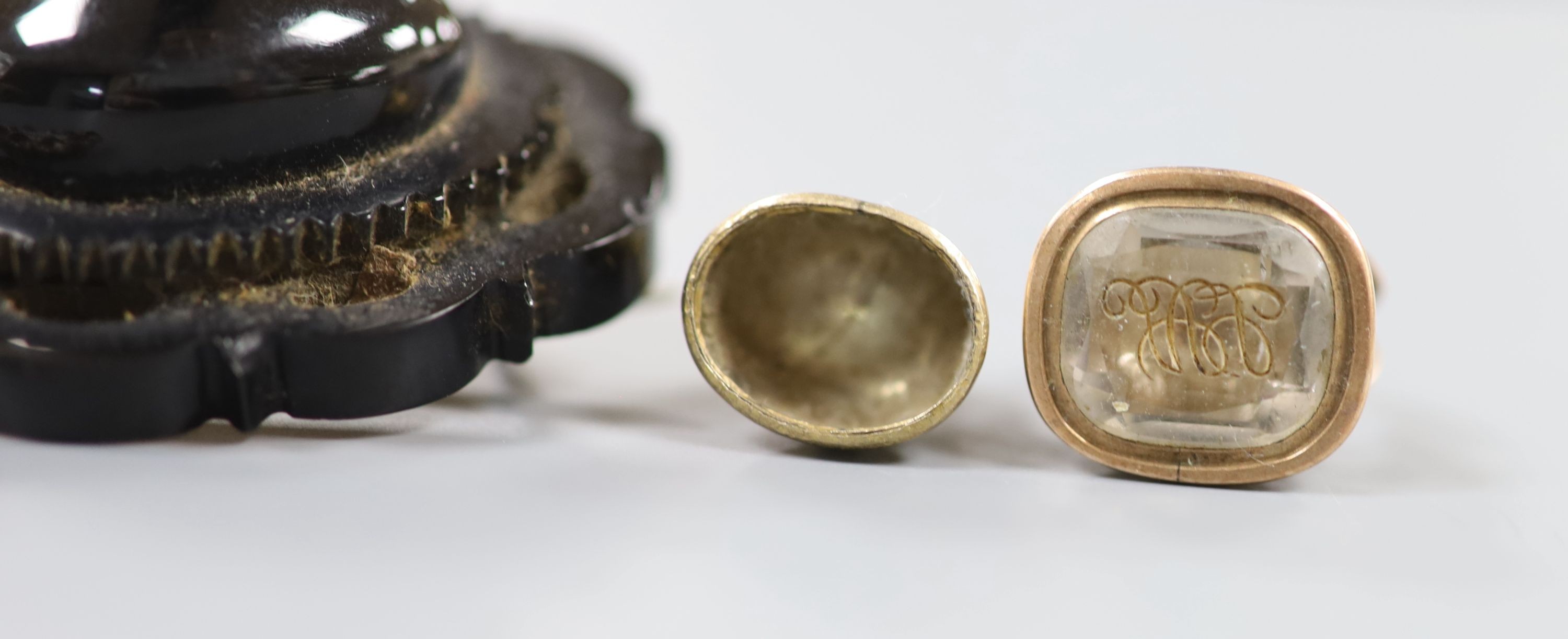 A Victorian yellow metal overlaid and bloodstone set fob seal, 24mm, three other fob seals, one with vacant matrix and three mourning brooches, including seed pearl and black enamel, 40mm.